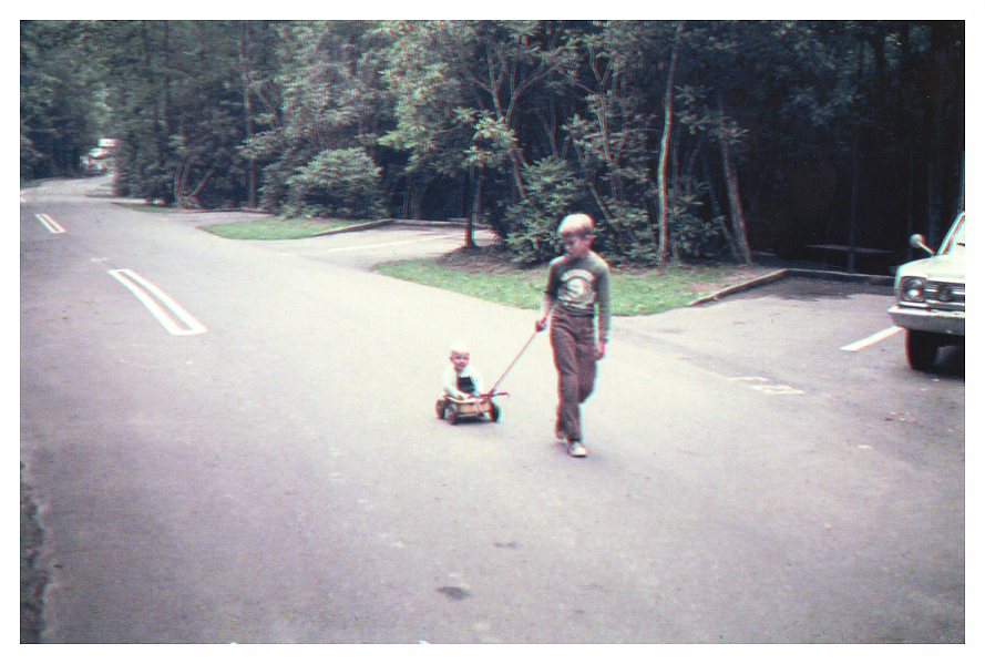 Kendall Whitesell pulling Allan Capps at Julian Price Campground, NC - about 1974.